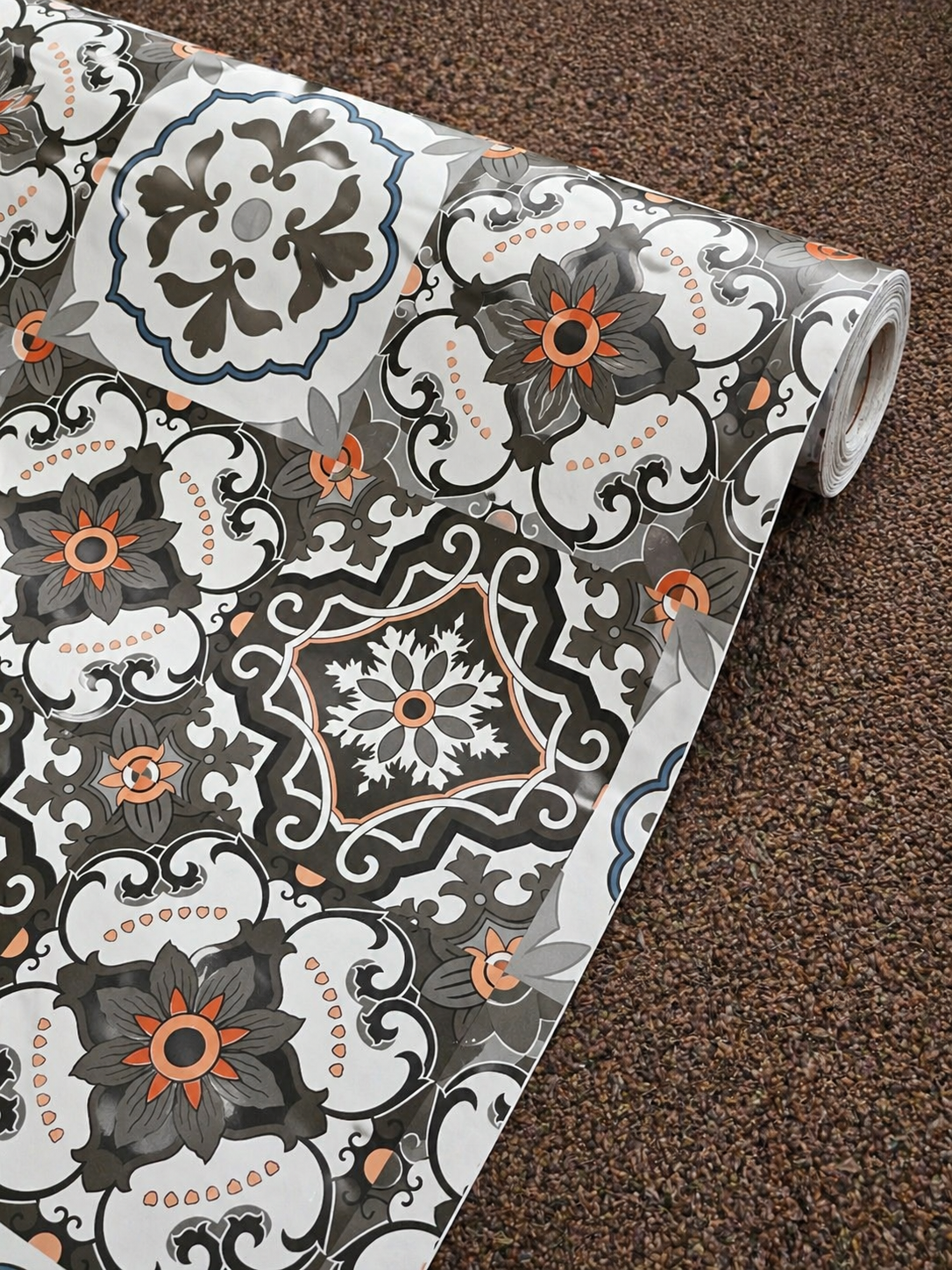Budget Interiors mosaic tile effect peel-and-stick roll for flooring, showing the patterned tile design on a smooth surface.