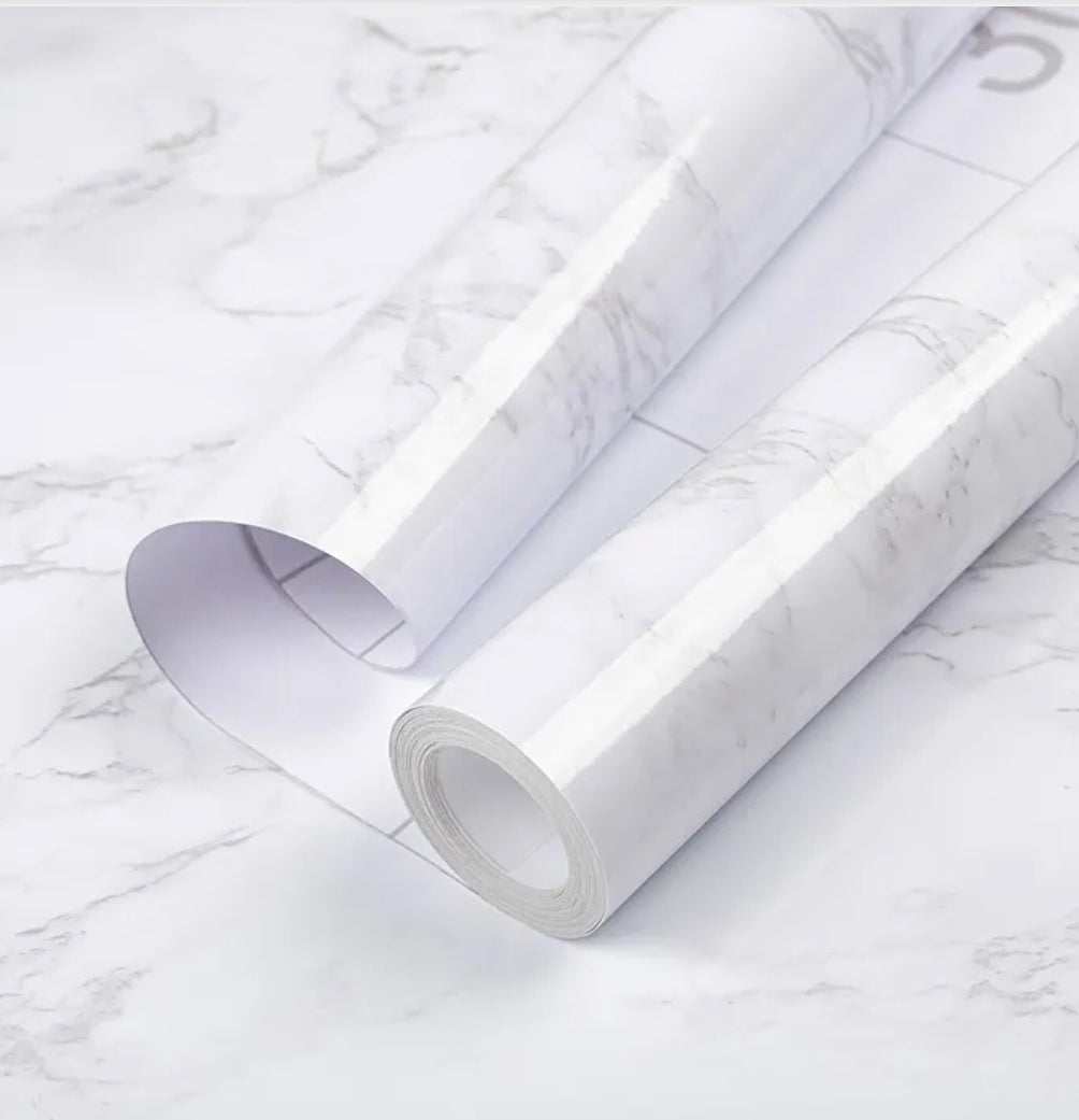 White and grey gloss self-adhesive granite effect film by Budget Interiors, showing a close-up of the textured, reflective surface.