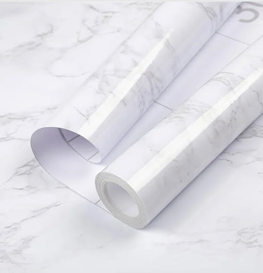 White and grey gloss self-adhesive granite effect film by Budget Interiors, showing a close-up of the textured, reflective surface.