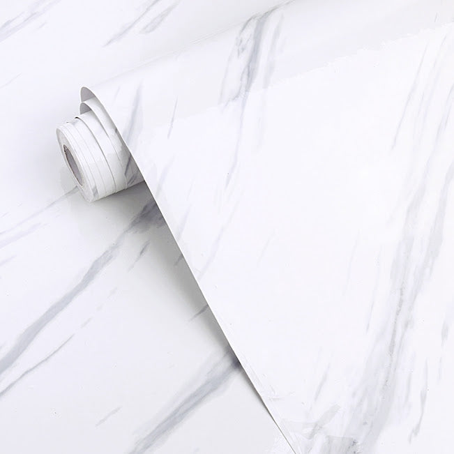 White gloss marble surface with polished finish, showcasing elegant natural veining, by Budget Interiors.