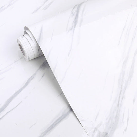 White gloss marble surface with polished finish, showcasing elegant natural veining, by Budget Interiors.