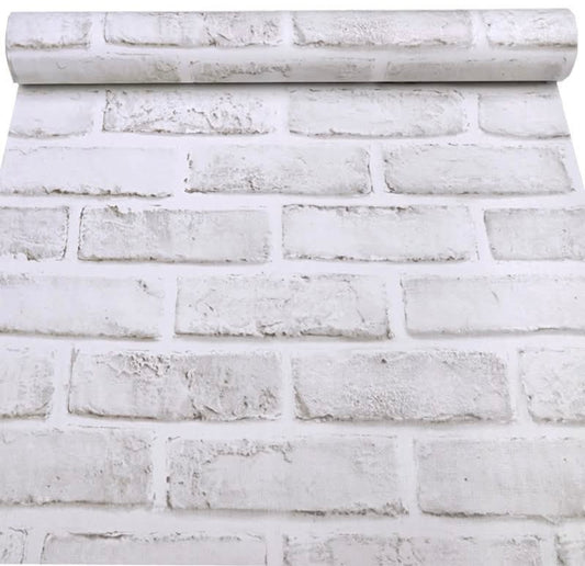 White brick self-adhesive wallpaper roll by Budget Interiors, shown rolled out with textured brick pattern on smooth surface.