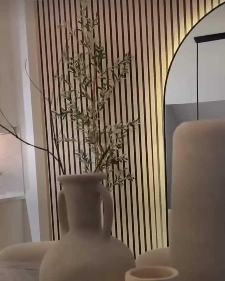 Acoustic wallpaper paneling by Budget Interiors showcasing textured soundproofing wall panels in a modern interior setting.